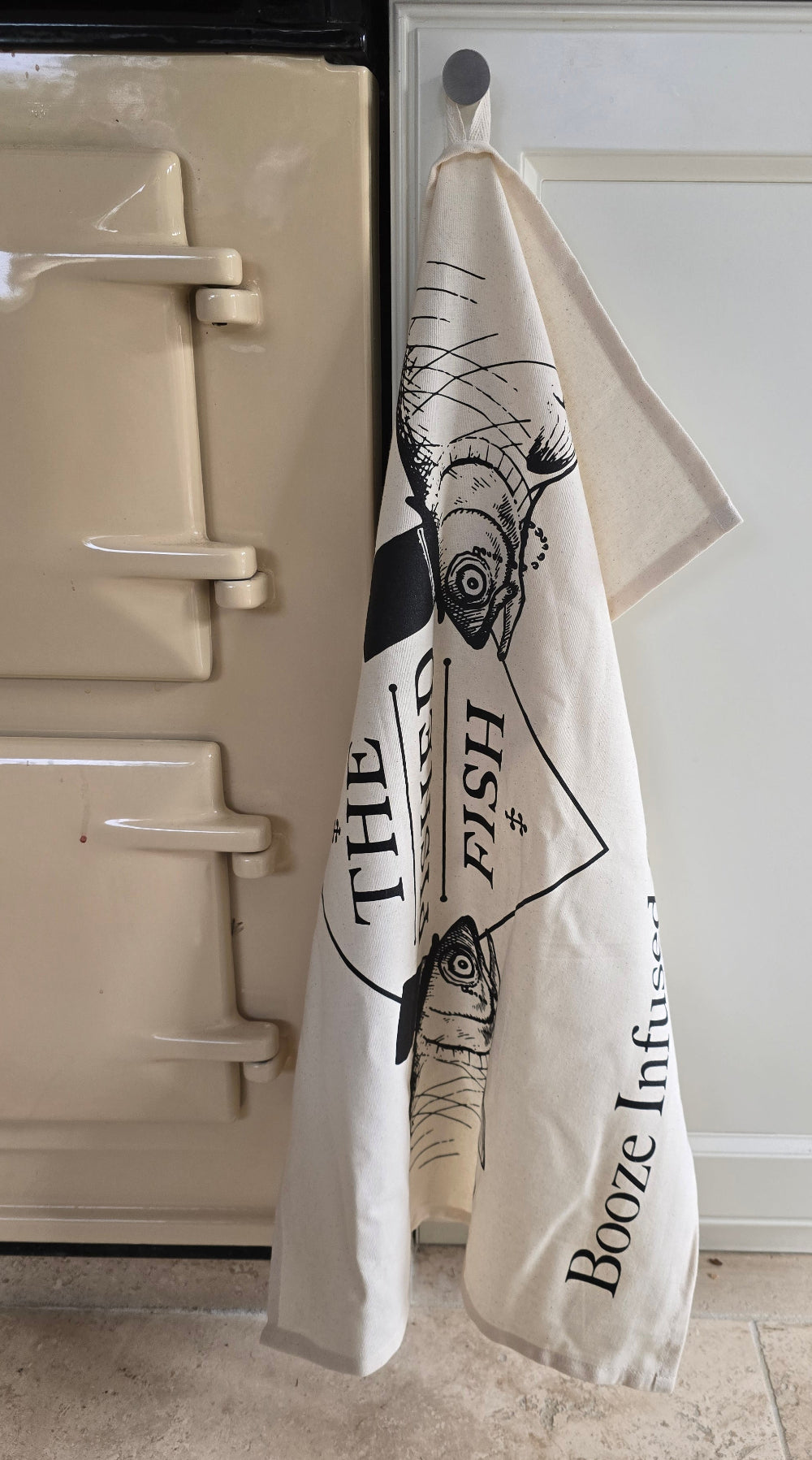 Tea towel with pished fish logo